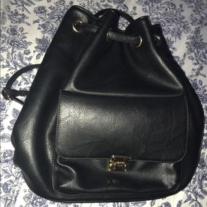 Black Backpack w/ black&white stripped interior